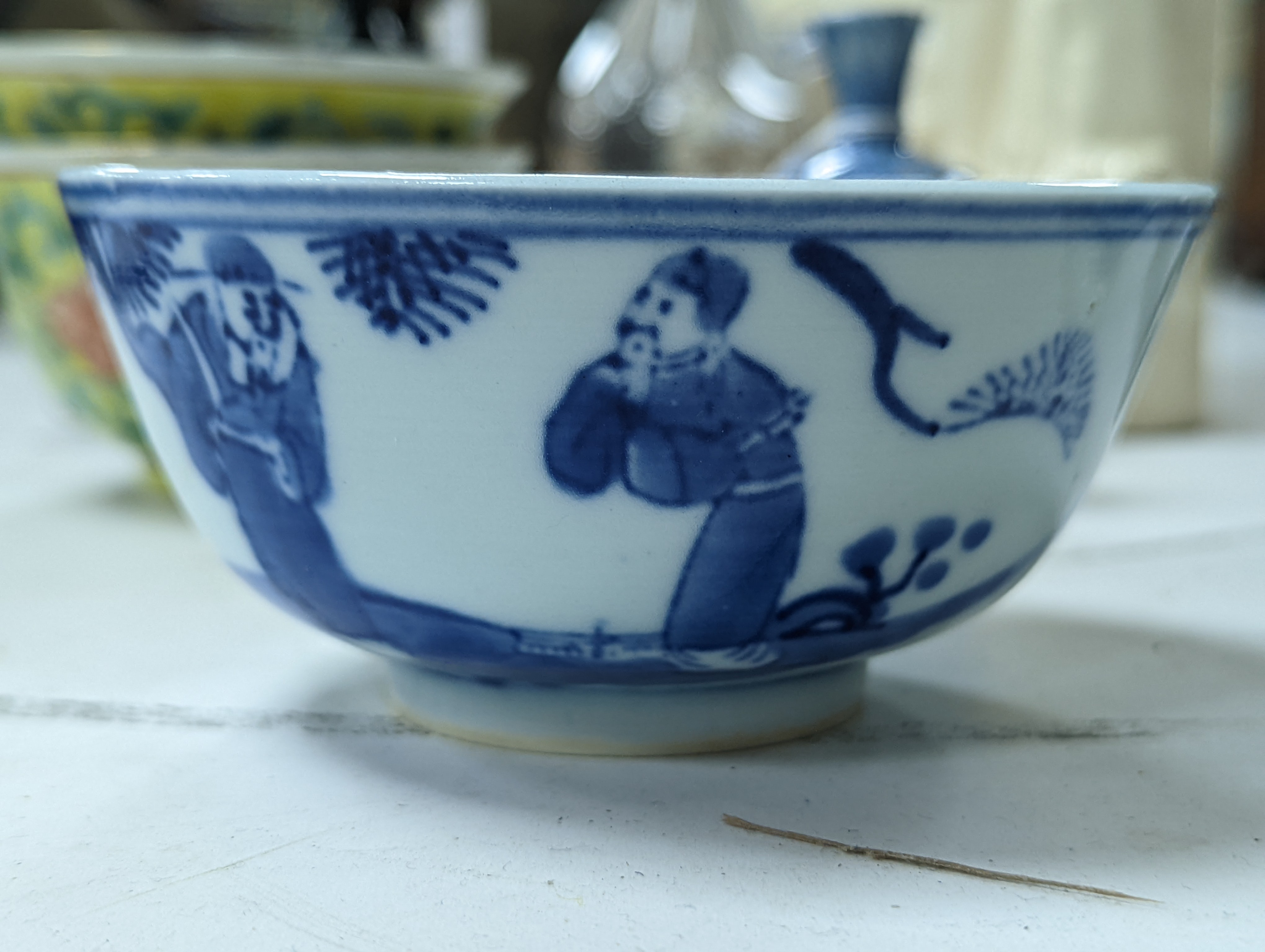 A group of Chinese porcelain, 19th /20th century, to include a pair of yellow ground bowls, 10.8 cm diameter, a blue and white vase, Xuande mark, a similar bowl and vase, and a champleve enamel bronze koro and cover